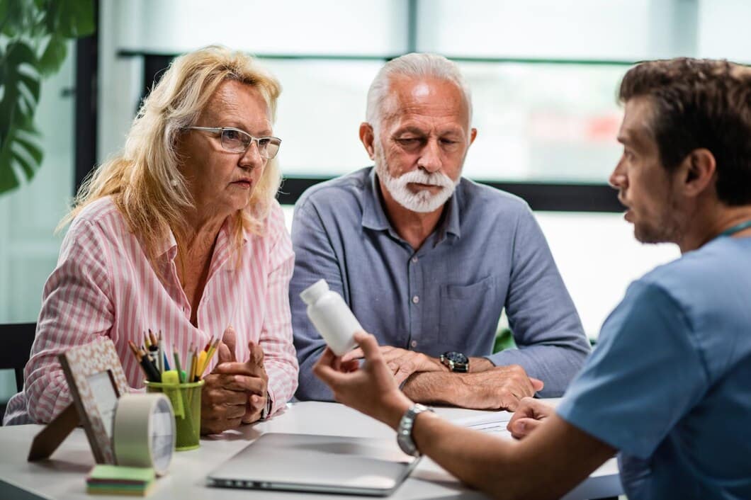 older couple discussing Rx with doctor